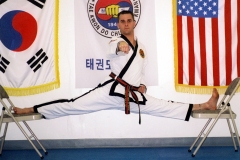 Master O'Connor demonstrates his flexibility with a split between two chairs.